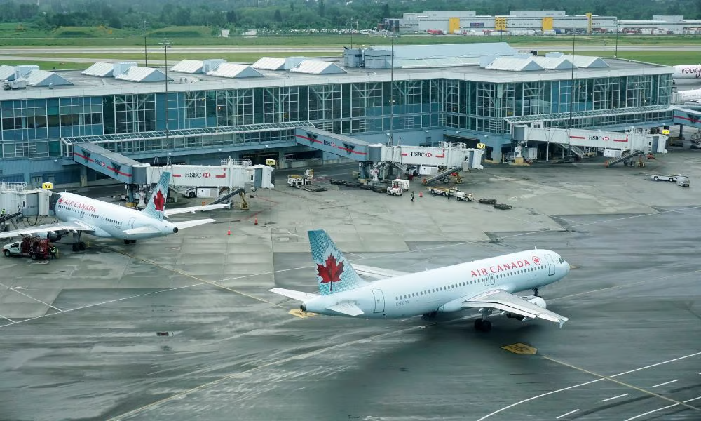 Commercial aircraft parked at terminal gates on an airport apron