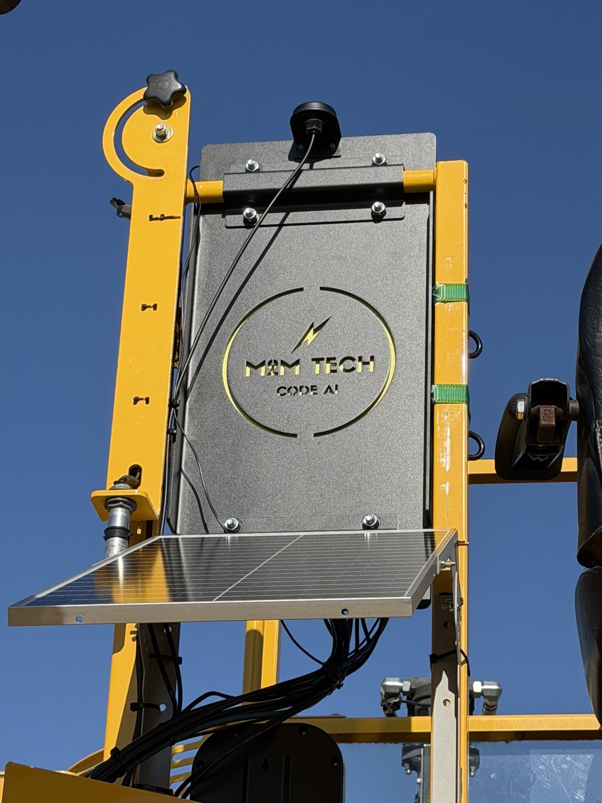 Close-up of M2M Tech CODE.AI edge enclosure with solar panel and camera