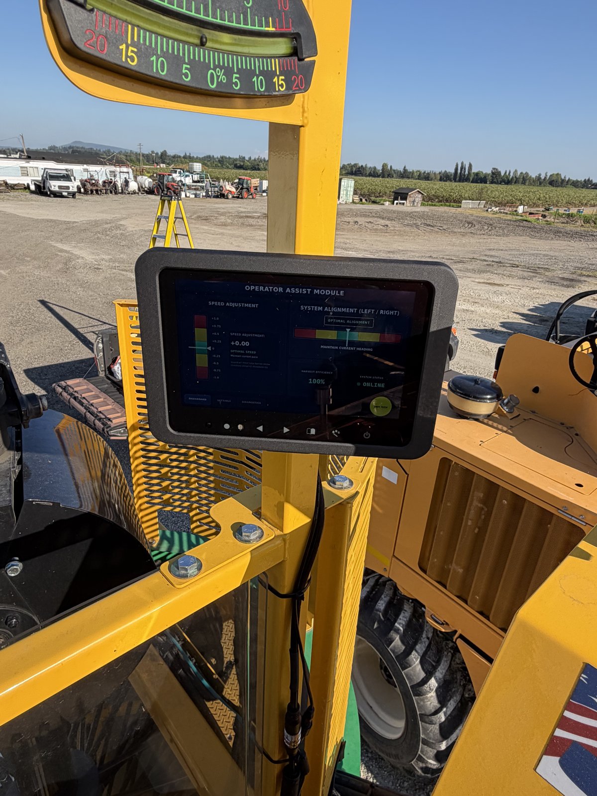 Operator assist tablet mounted near the cab showing speed and alignment feedback